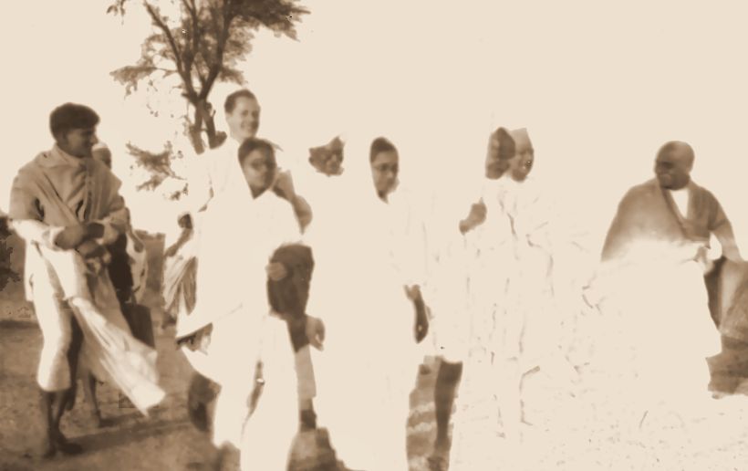 My grandfather (back, left) walking with Mahatma Gandhi’s party in India. The print had faded almost to white; this is as much as could be recovered.