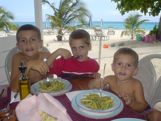 The boys eating pesto at Trattoria, April 2003.