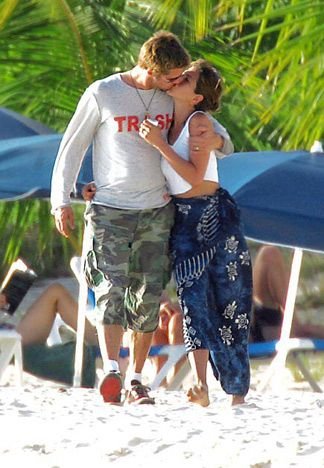 Brad and Jen on the beach during their last lunch at Trattoria, and their last in Anguilla, January 2005. Courteney Cox and David Arquette, and Liam Neeson and Natasha Richardson, were with them. The photo also appeared in Us Weekly a week later.