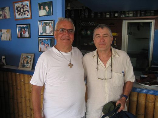 Robert De Niro with my uncle, Don Mauro. They are standing in front of the original wall, by the first entrance near the kitchen, before hurricane damage moved it to the other side of the bar. The photograph ended up behind the counter of his parish bar in Italy, where nobody believed it.