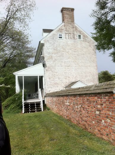 The side of the house and the old brick wall, April 2012.