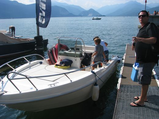 Later that morning, their boat. Stepping across from the dock, I misjudged the weight of the boat and my own: the hull went down under me and came back up, and their younger son, Lapo, went into the air and then into the lake. I was a little heavier then.