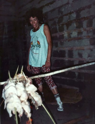 Chickens roasting on a spit at camp.